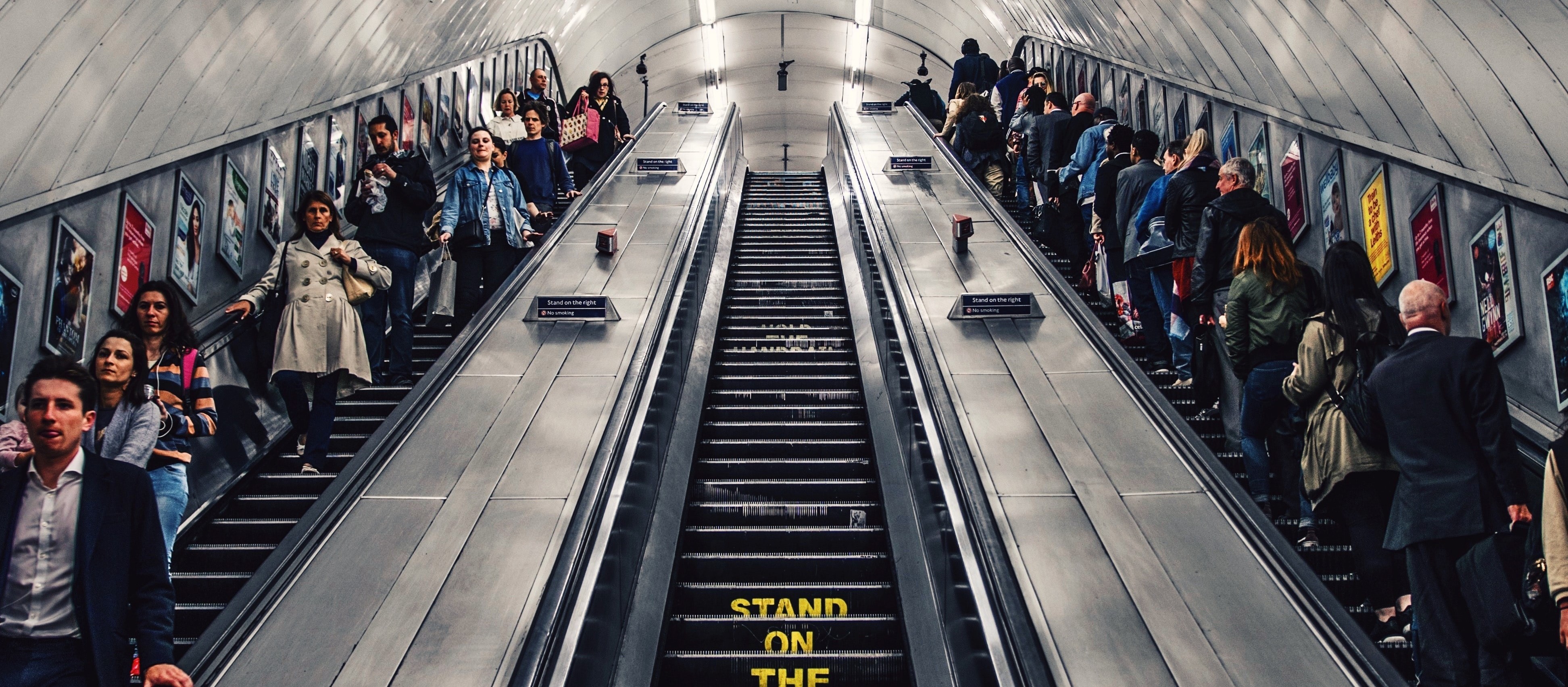 London underground escalators with people on either side