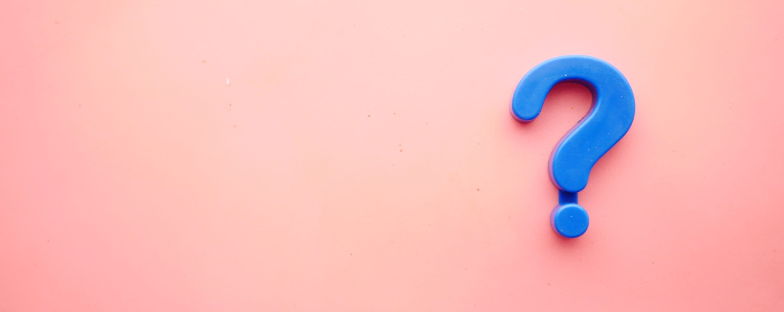 Blue question mark on pink background