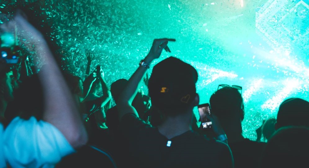 Crowd of people dancing at concert